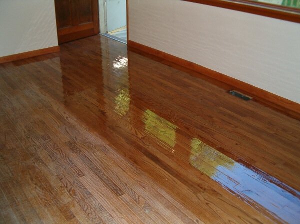 a living room floor in the process of being resurfaced
