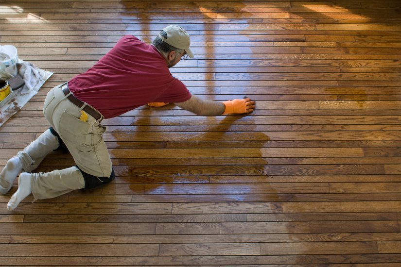 Fabulous Floors a technician refinishing a hardwood floor